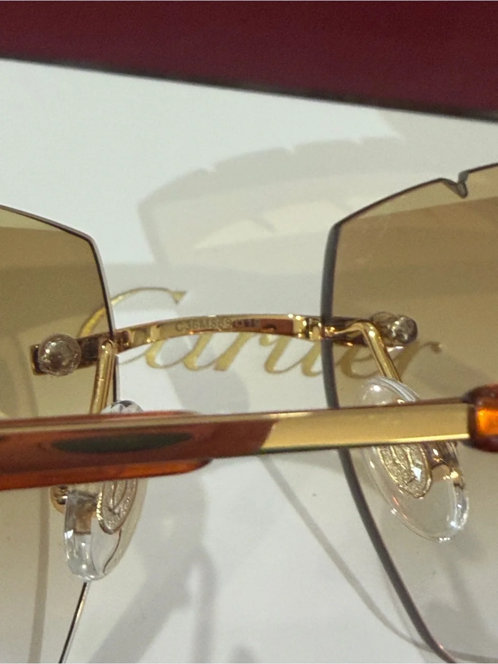 Cartier Men's Rimless Sunglasses with Purple Lenses and Gold Bridge